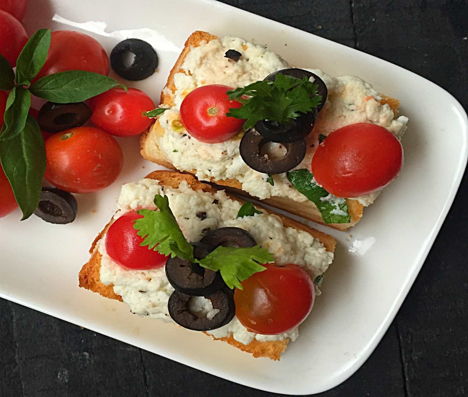 Ricotta Crostini with Olives and Cherry Tomatoes